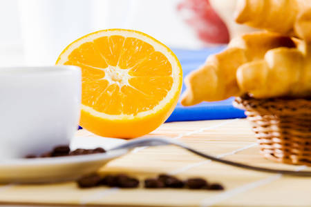Croissants and cup of coffee on breakfast tableの写真素材