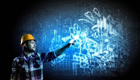 Image of man builder drawing project sketchの写真素材