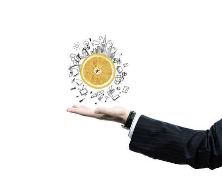 Close up of businessman hand holding sketches of buildingsの写真素材