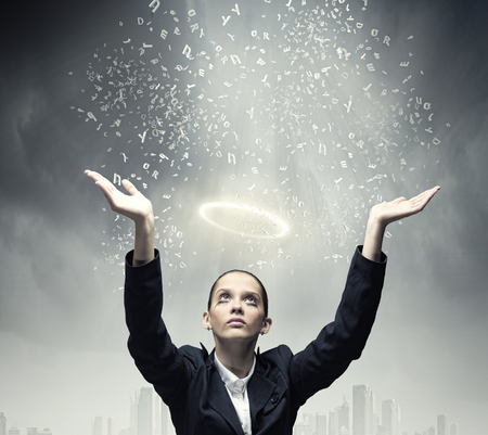 Young crying businesswoman with halo above headの写真素材