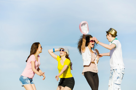 Young happy people having fun outside in summerの写真素材