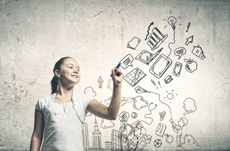 School pretty girl drawing sketches with markerの写真素材