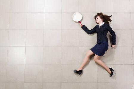 Funny image of running businesswoman with pan in handの写真素材