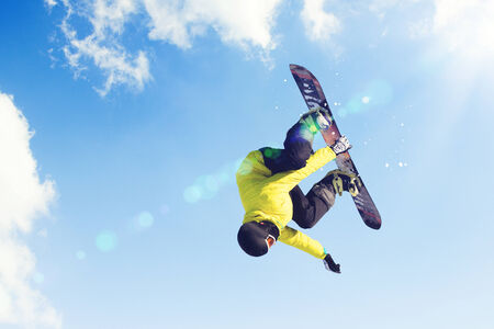 Man on snowboard jumping in sky  Summer vacationの写真素材