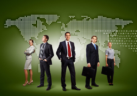 Image of business people standing against world map の写真素材