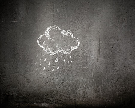 Conceptual image with raining cloud in handの写真素材