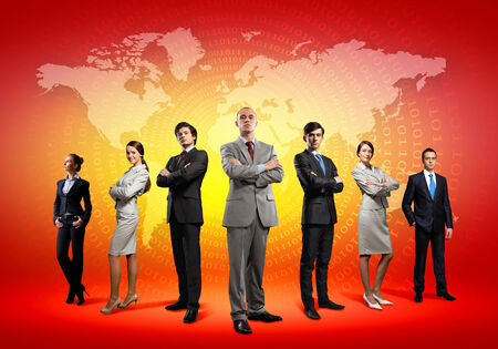 Image of business people standing against world map の写真素材