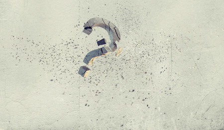 Conceptual image with stone broken question markの写真素材
