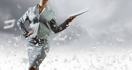 Close up of businesswoman holding papers in handsの写真素材