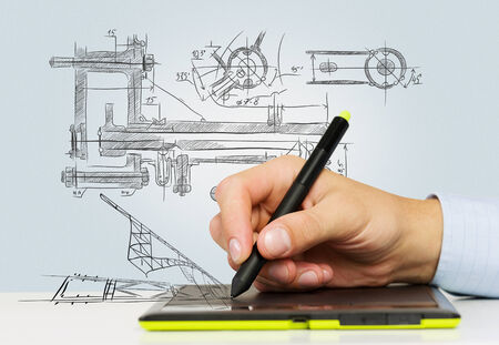 Close up of human hand working with tabletの写真素材