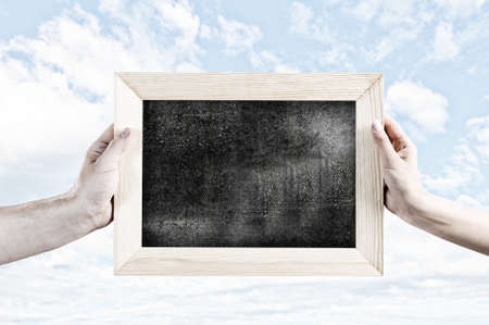 Close up of human hands holding blank frameの写真素材