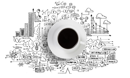 Conceptual image of cup of coffee with business sketches at backgroundの写真素材