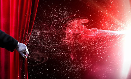 Human hand in white glove opening red velvet curtainの写真素材