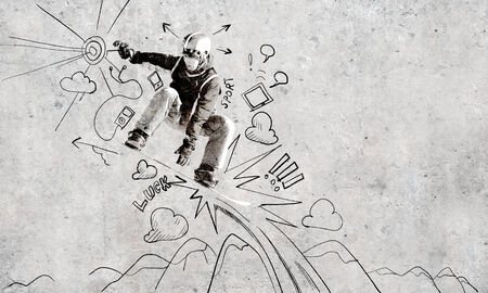 Close up of hand drawing sketches of snowboarderの写真素材