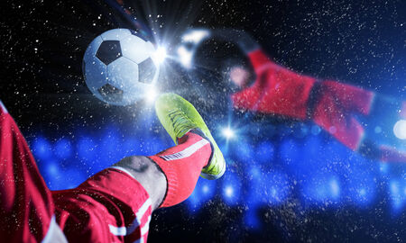 Close up image of footballer foot kicking the ballの写真素材