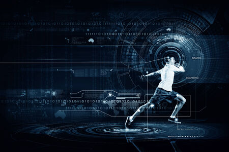 Young running man against digital media backgroundの写真素材