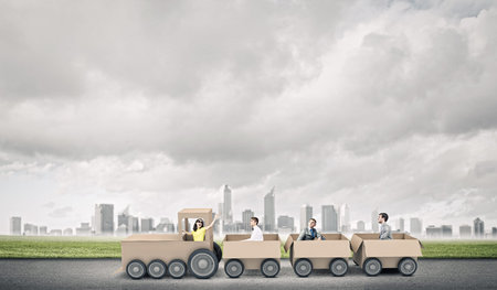 Young business people riding carton train  Teamwork conceptの写真素材