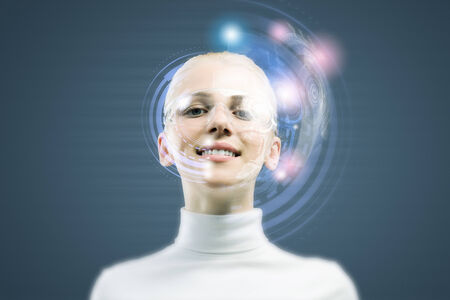 Young woman in white with hologram round headの写真素材