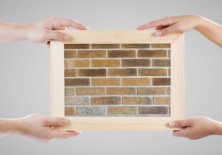 Close up of hands holding blank chalkboardの写真素材