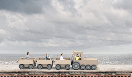 Young business people riding carton train  Teamwork concept