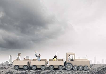 Young business people riding carton train  Teamwork conceptの写真素材