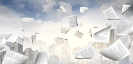 background image with papers flying in airの写真素材