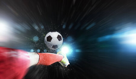 Close up image of footballer foot kicking the ballの写真素材