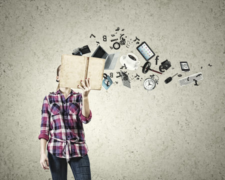 Young woman in casual hiding face behind reading