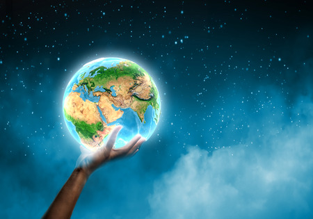 Close up of human hand holding Earth planet  Elements of this image are furnished by NASAの写真素材