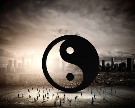 Conceptual image with yin yang sign and silhouettes of businesspeople aroundの写真素材