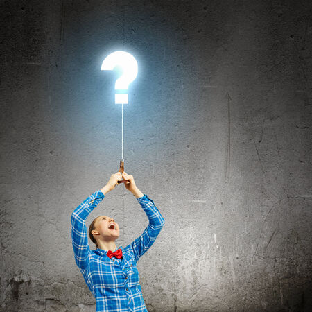 Young woman in casual holding balloon  Question conceptの写真素材
