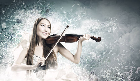 Young pretty asian woman playing violin  Young talentの写真素材