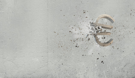 Conceptual image with stone broken euro signの写真素材