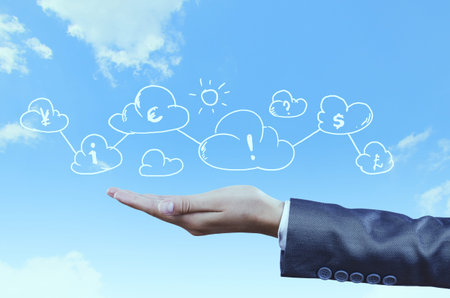 Close up of businessman hand and business symbols