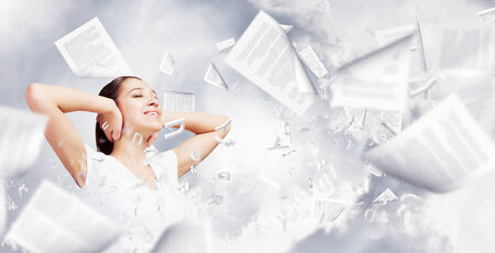 Young woman closing her ears with palms and enjoying the silenceの写真素材