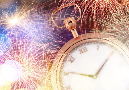 Conceptual image of clock with bokeh lights and fireworkの写真素材