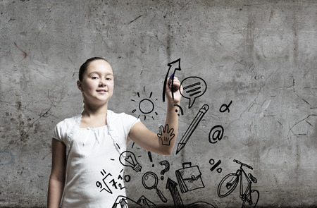 School pretty girl drawing sketches with markerの写真素材