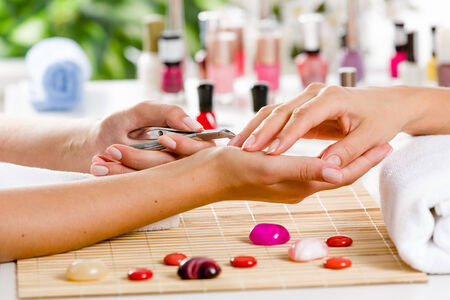 Close up of process of manicure at beauty salonの写真素材