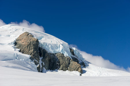Mountain landscape with snow and clear blue sky