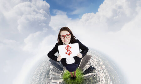 Top view of excited businesswoman holding banner with dollar signの写真素材