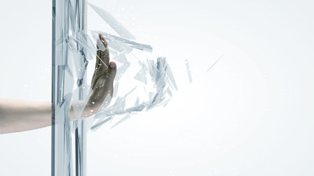 Close up of male hand breaking glass with palm