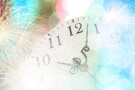 Conceptual image with pocket watch bokeh lights and fireworks