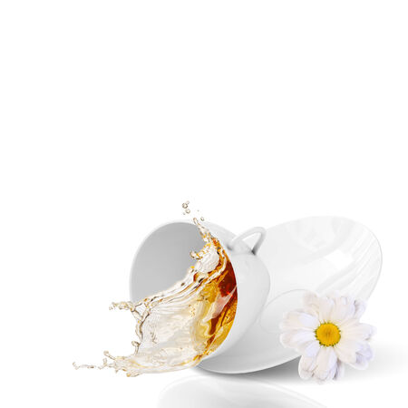 White cup of tea with chamomile flowerの写真素材