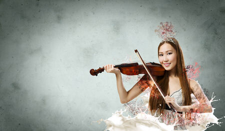 Young pretty asian woman playing violin  Young talentの写真素材
