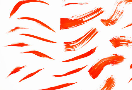 Abstract smears of orange paint on white background