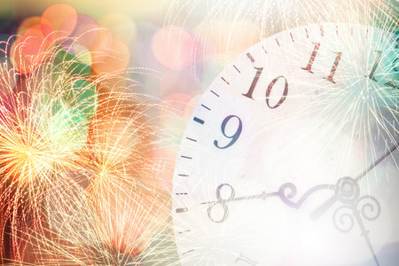 Conceptual image with pocket watch bokeh lights and fireworks