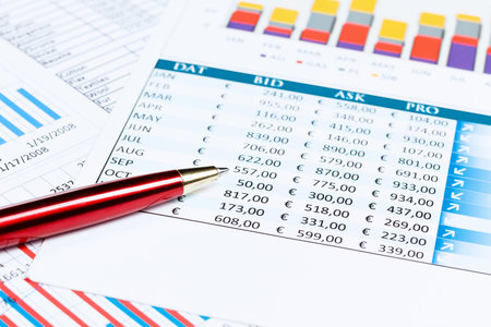 Close up of papers with graphs and diagrams