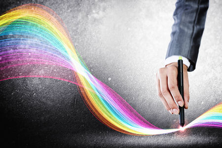 Close up of designer hand drawing colorful loopsの写真素材