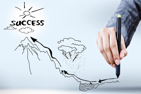 Close up of businessman hand drawing business sketchesの写真素材