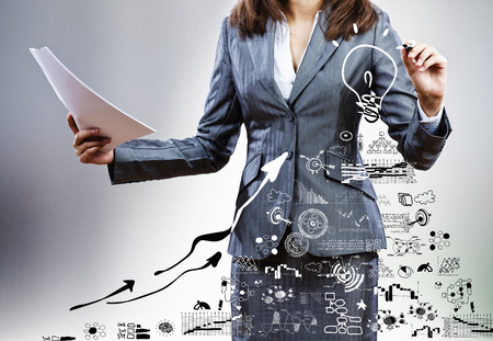 Bottom view of businesswoman drawing business sketchesの写真素材